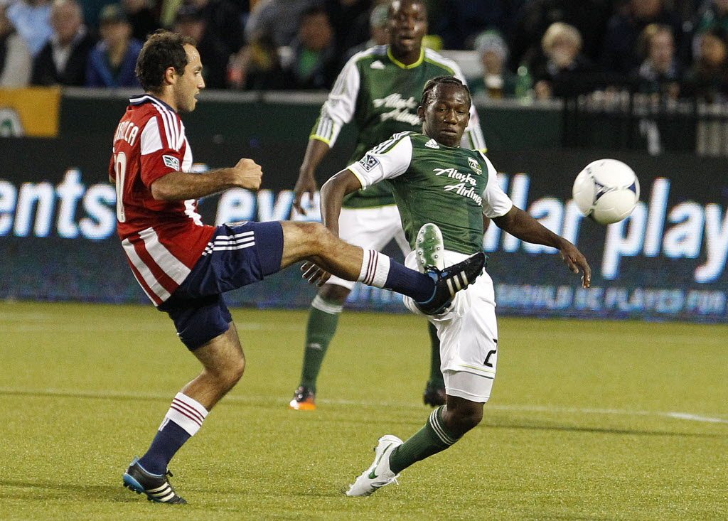 Chivas USA's Nick LaBrocca kicks the ball as Portland Timbers' Diego Chara defends in the second half.