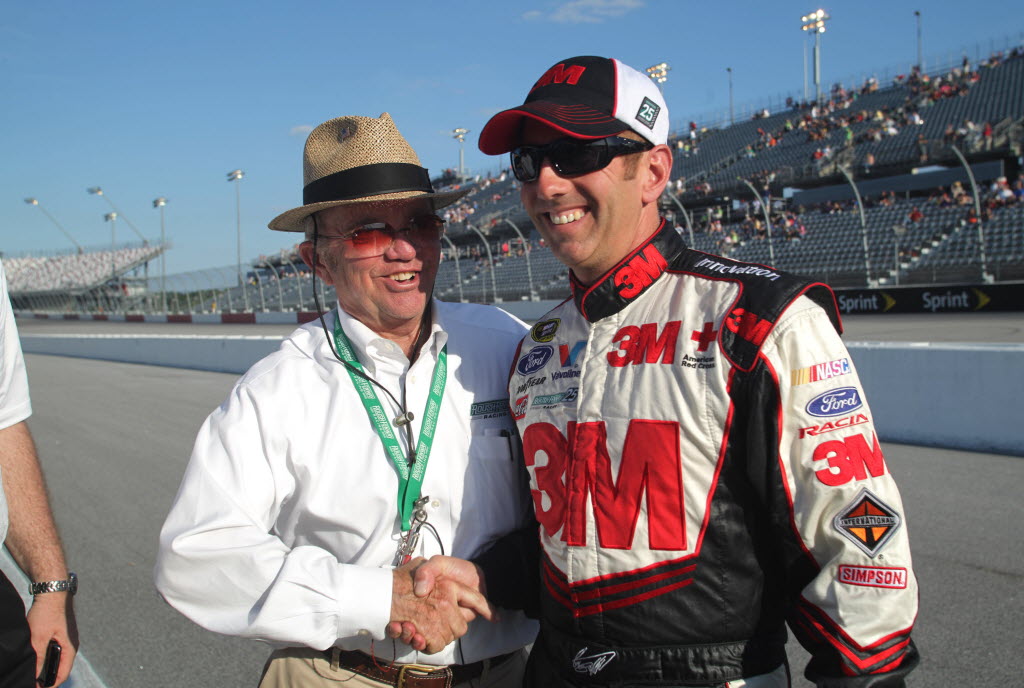 Roush Racing team owner Jack Roush, left, congratulates Greg Biffle after Biffle won the pole during qualifying for the NASCAR Sprint Cup Southern 500.