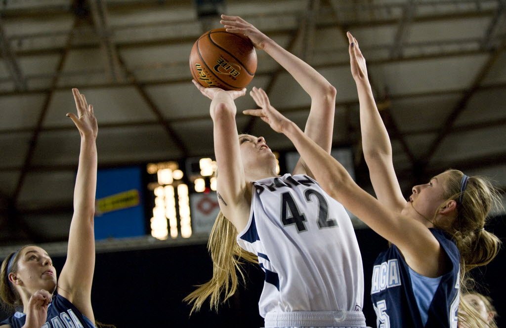 Skyview's Katie Swanson shoots over Gonzaga Prep defenders at the 4A state basketball tournament in Tacoma on Friday.