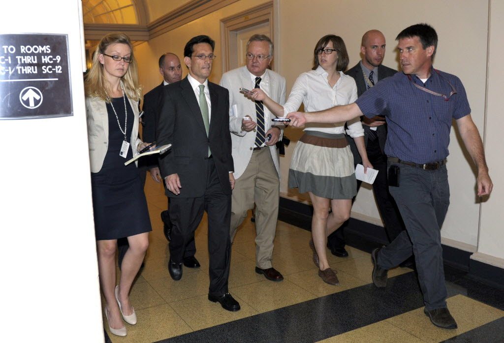 House Majority Leader Eric Cantor of Va., is followed by reporters as he walks out of a caucus meeting Friday on Capitol Hill in Washington.