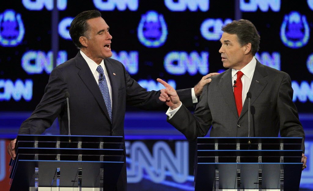 Republican presidential candidates former Massachusetts Gov. Mitt Romney, left, and Texas Gov.