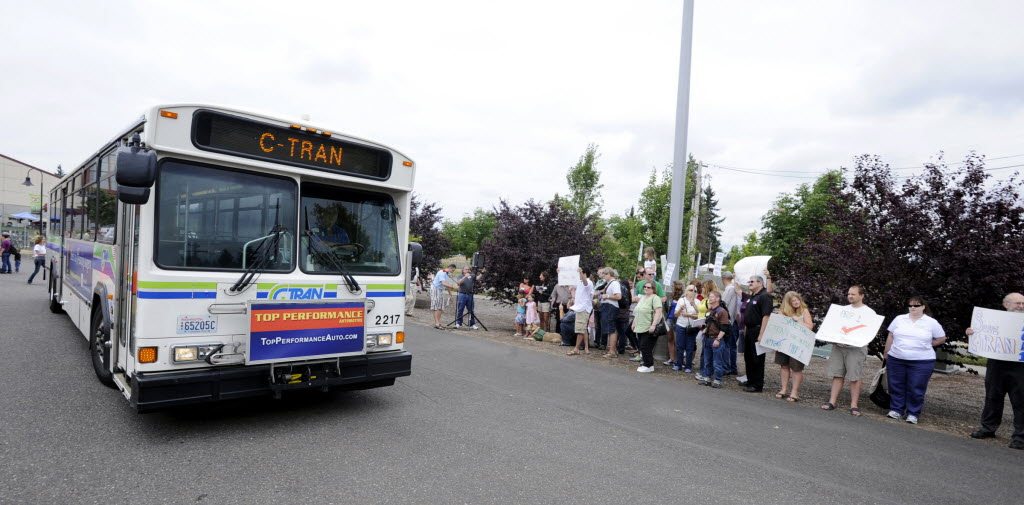 A C-Tran bus passes a group of supporters of Proposition 1 as they rally for a C-Trans sales tax increase outside the east entrance to the Clark County Fair in Ridgefield on August 13. Both opponents and supporters are making a final push ahead of the Nov.