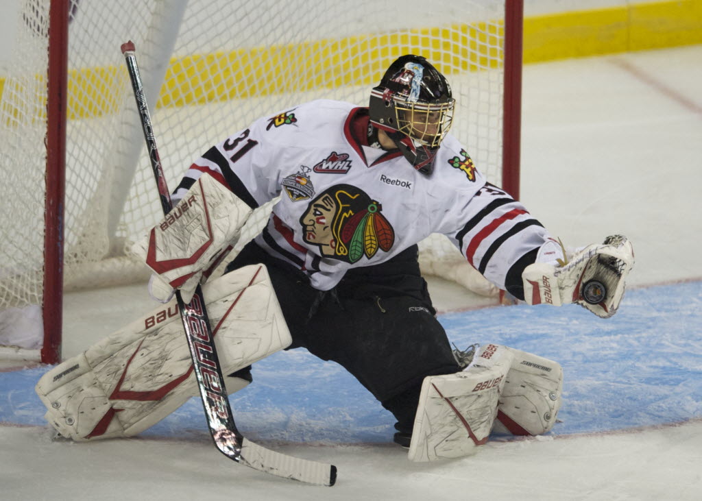 Winterhawks' goaltender Mac Carruth makes a glove save against the Oil Kings in the third period of game 6 at the Rose Garden on Saturday.