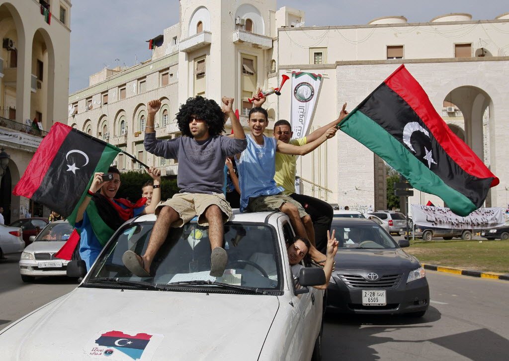 Libyans celebrate Moammar Gadhafi's death in Tripoli, Libya, Thursday, Oct. 20, 2011.