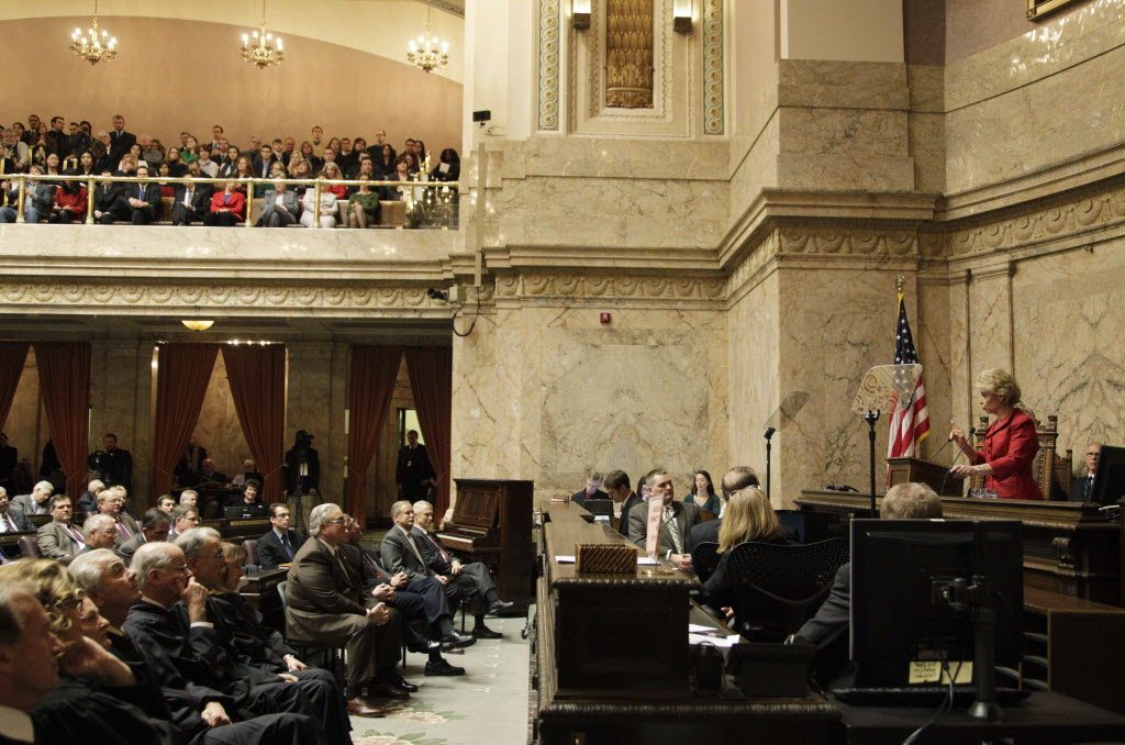 Washington Gov. Chris Gregoire, right, gives her 2011 State of the State address to a joint session of the Washington Legislature Jan.