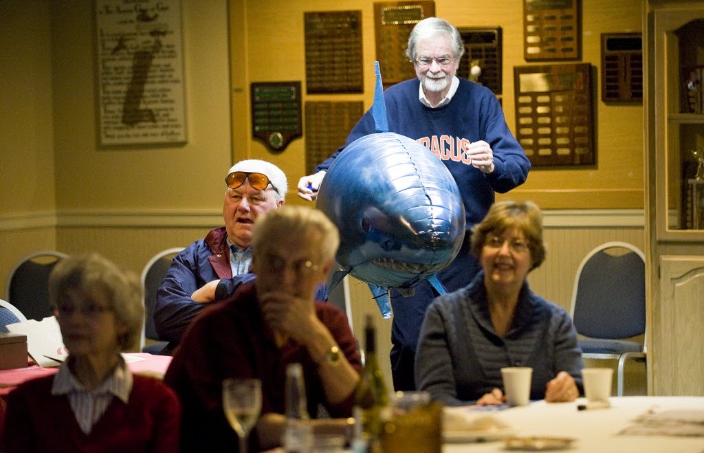 Richard Heydet prepares what he calls the &quot;halftime entertainment&quot; during a Super Bowl party at the Fairway Village clubhouse on Sunday.