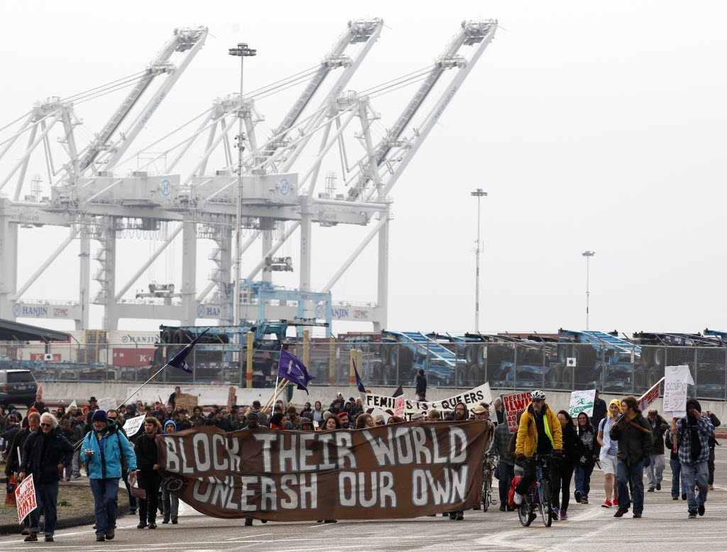 Protestors leave the Port of Oakland after successfully blocking the entrances, Monday in Oakland, Calif.