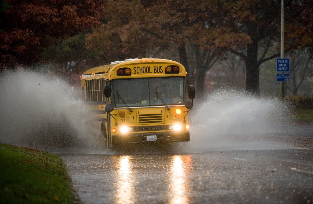 A School bus plunges into standing water on N.E. 136th Ave. near N.E.