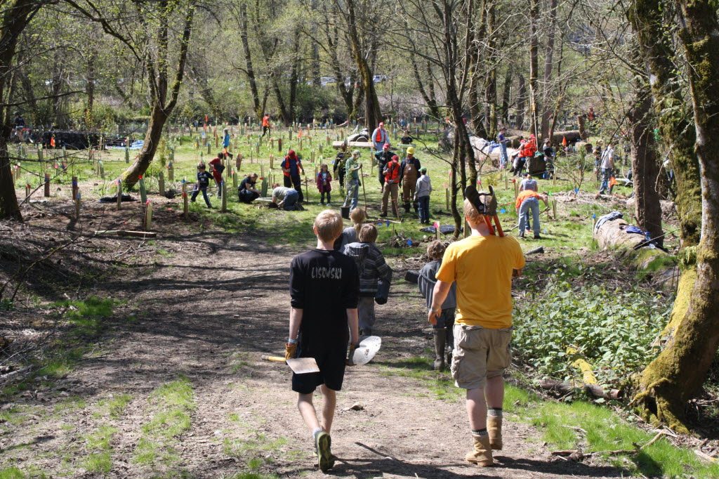 Hundreds of people turned out in April 2011 at Salmon Creek Regional Park to plant trees as part of StreamTeam's Earth Day celebration.