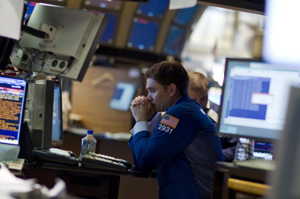 A trader works on the floor of the New York Stock Exchange on Thursday in New York. The Dow plunged nearly 513 points Thursday, its biggest point decline since Oct.