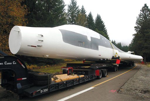 In this photo taken Nov. 8, 2011, a B-1 bomber being transported from Tucson, Ariz. to Renton, Wash., rests on a trailer at a rest area on Interstate 5 north of Glendale, Ore.