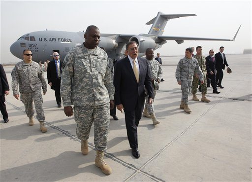 US Sec. of Defense Leon Panetta, right, walks across tarmac with Army Gen. Lloyd Austin, left, Commander of US Forces Iraq, during his arrival at Baghdad, Iraq, Thursday, Dec., 15, 2011. Panetta is participating in the ceremonies marking the end of the US military mission in Iraq.