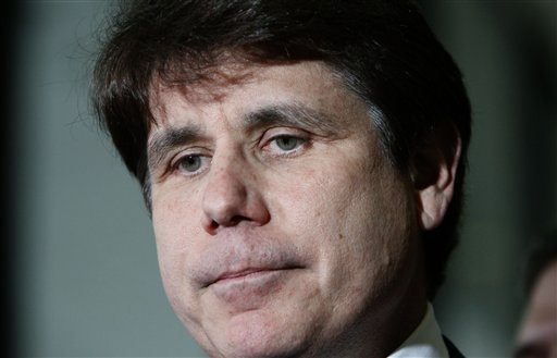 FILE - In this June 9, 2011 file photo, former Illinois Gov. Rod Blagojevich pauses as he talks with reporters at the Federal Court building after the judge handed the case to the jury in his corruption trial in Chicago. Jurors deliberating in Blagojevich's corruption trial told a judge on Monday, June 27, 2011, that they have reached a verdict on 18 of the 20 counts against him, and attorneys in the case have agreed that the verdict should be read.