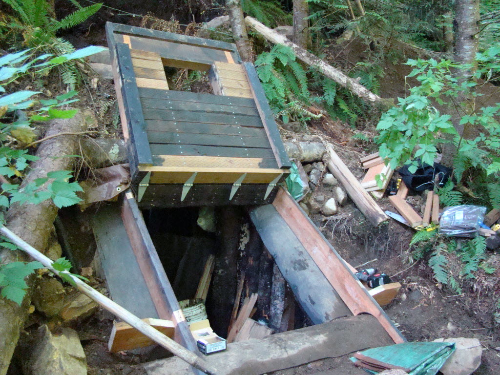 This photo provided by the King County Sheriff's Department shows a bunker in the Cascade foothills east of Seattle where a man suspected of killing his wife and daughter was found dead Saturday of a self-inflicted gunshot wound.