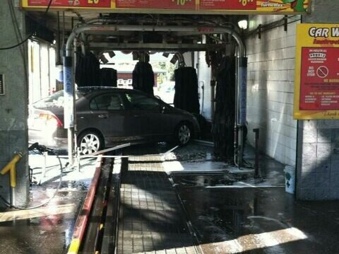 A car slammed into a car wash Thursday morning at a Shell station in east Vancouver .
