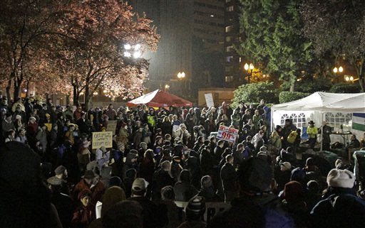 Hundreds of protesters and supporters gather hours before a mandate from the city to vacate the Occupy Portland Camp in Portland Saturday.
