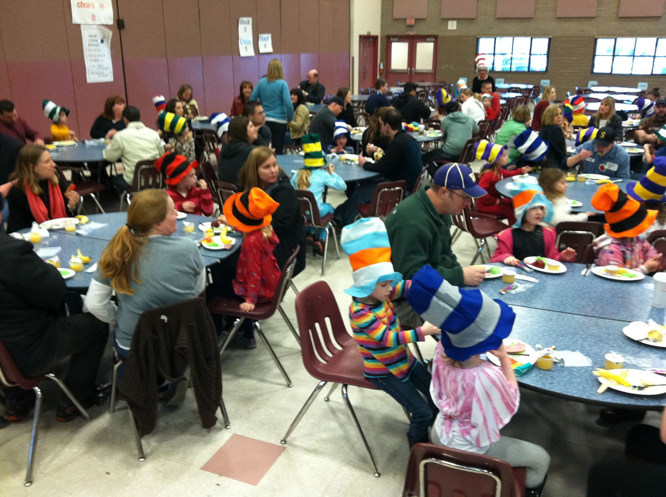 Students and adults alike enjoy their green eggs and ham breakfast at Chinook Elementary School.