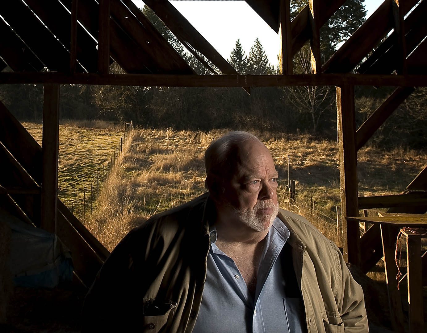 Chuck Cushman, executive director of the American Land Rights Association, stands inside an old barn on his Battle Ground property.He's fighting against Rialto Capital Management in hopes of spurring changes in how the government handles bank closures.