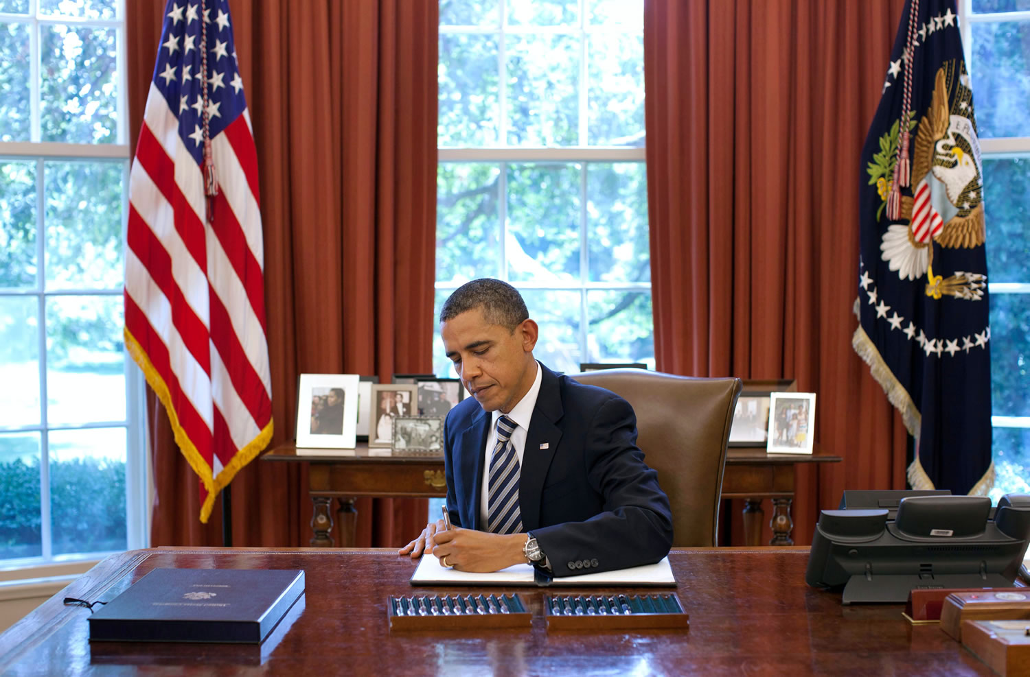 President Barack Obama signs the Budget Control Act of 2011 in the Oval Office on Thursday.