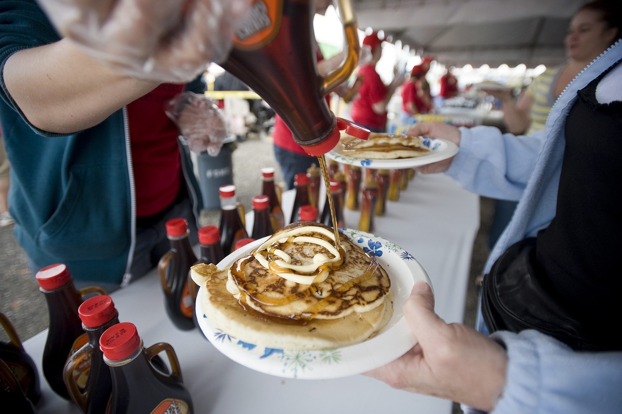 Syrup and margarine top a stack of pancakes during at the Clark County Fair on Friday.