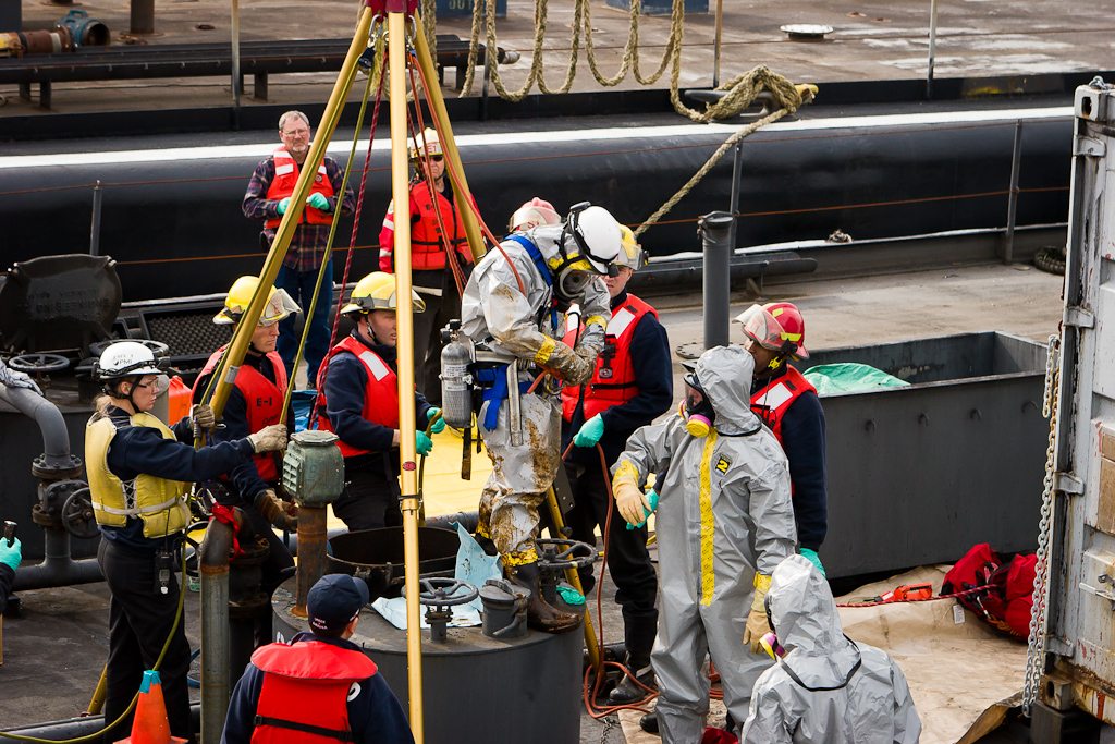 Portland firefighters recovered the body of a man from a barge tank Sunday.