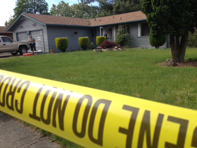 Officials with Clark County Major Crimes investigate a homicide Wednesday afternoon at 12216 N.E.