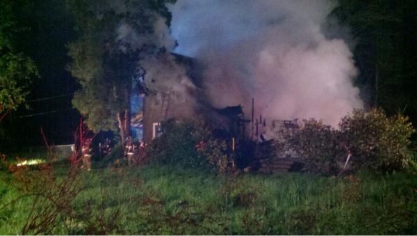 Smoke pours from a house at 26908 N.E. 45th Avenue east of Ridgefield on Tuesday night.