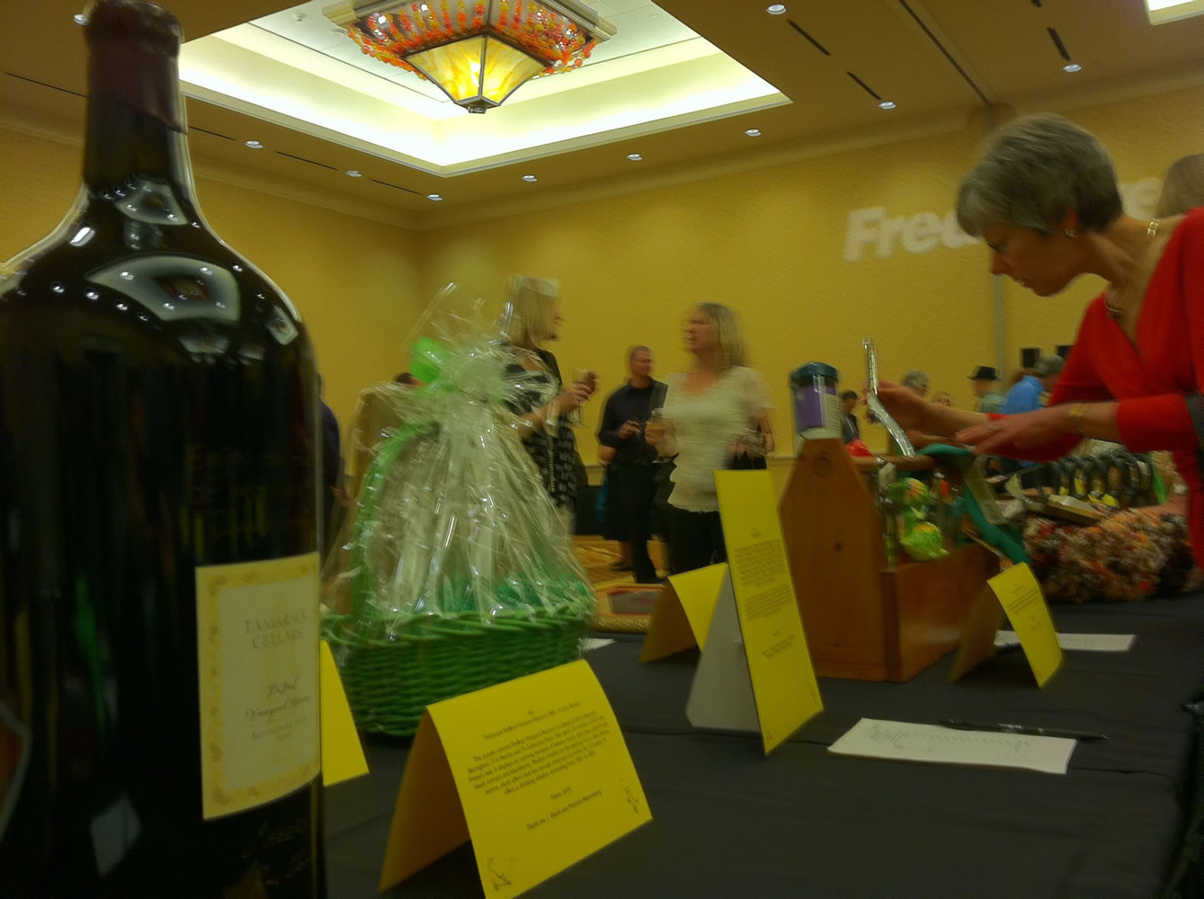 Supporters of the Humane Society for Southwest Washington take part in a silent auction Saturday as part of the group's &quot;It's a Wonderful Life&quot; dinner and auction at the Hilton Vancouver Washington.The 9 liter bottle of wine photographed sold for $563.