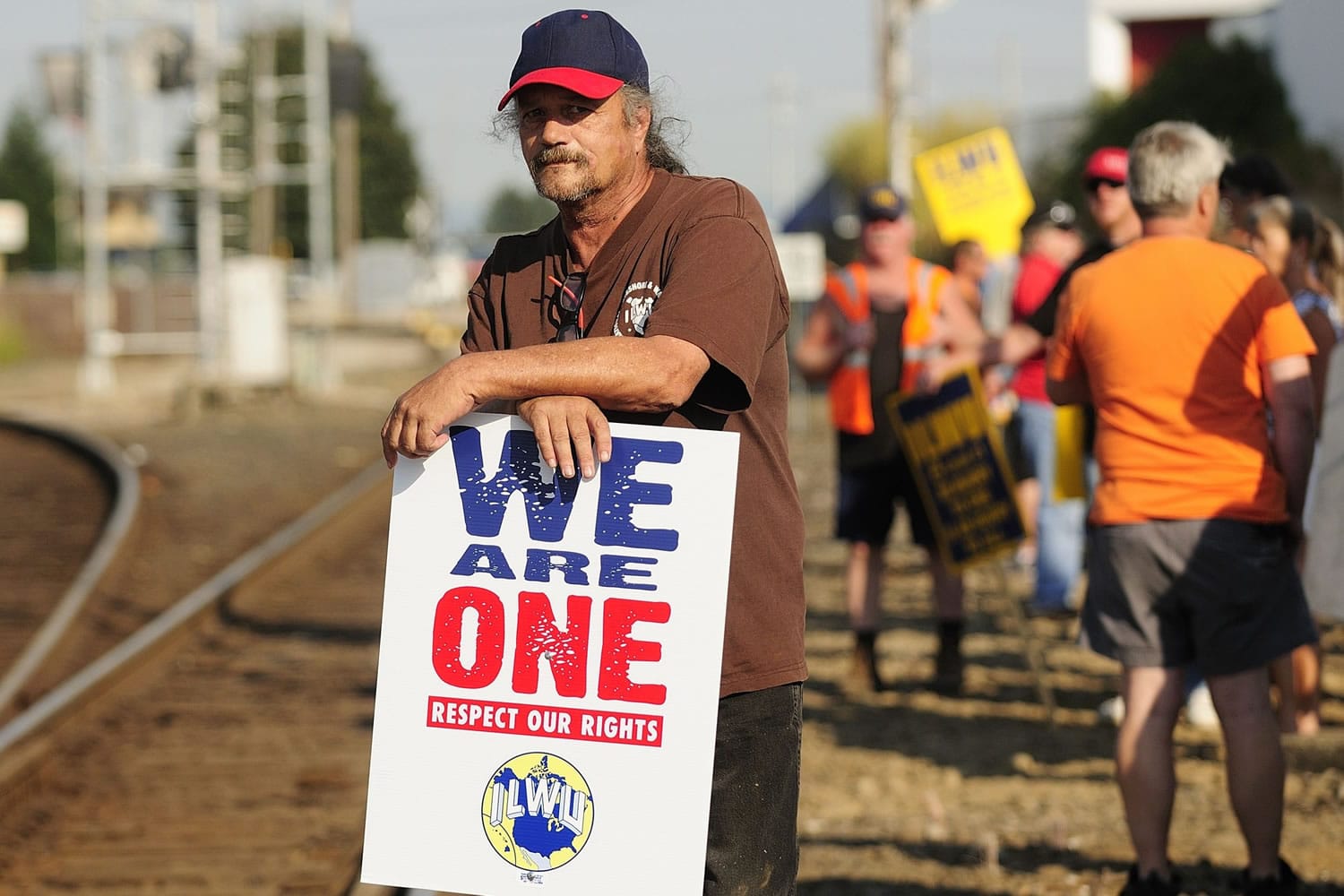 ILWU workers protest along rail lines on 8th Street on Wednesday in Vancouver.