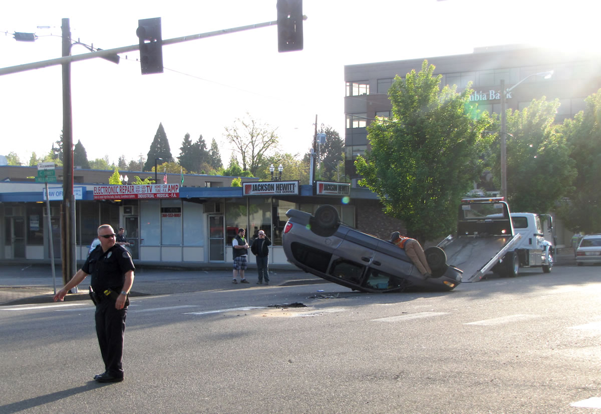 A flipped minivan blocked traffic at Mill Plain and C Street in downtown Vancouver Tuesday morning.