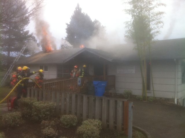 Vancouver firefighters work at the scene of an office fire at 3509 N.E. Stapleton Road Sunday.