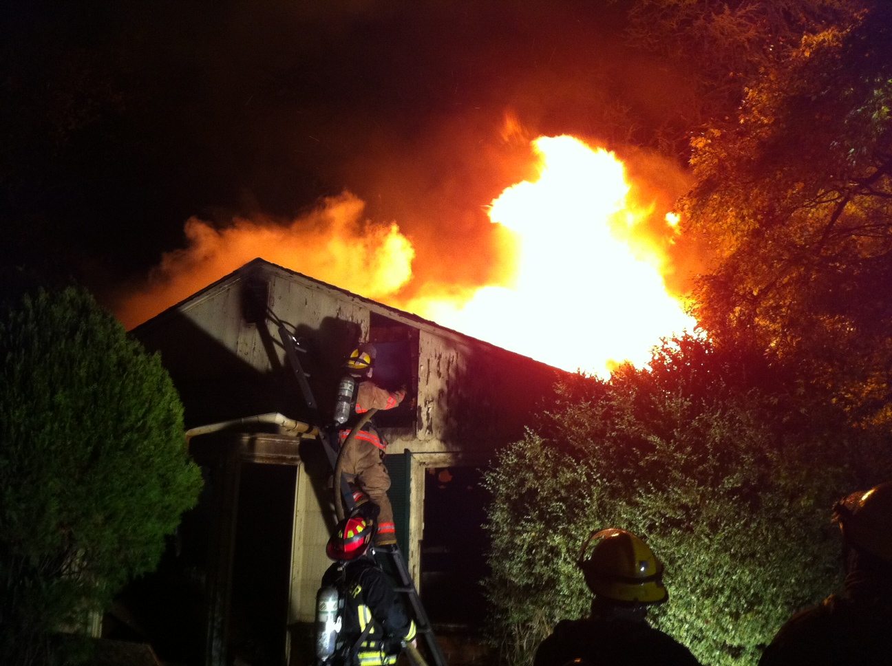 Firefighters battle a fire at an abandoned house at 8116 N.E. 32nd Street in Vancouver on Saturday.