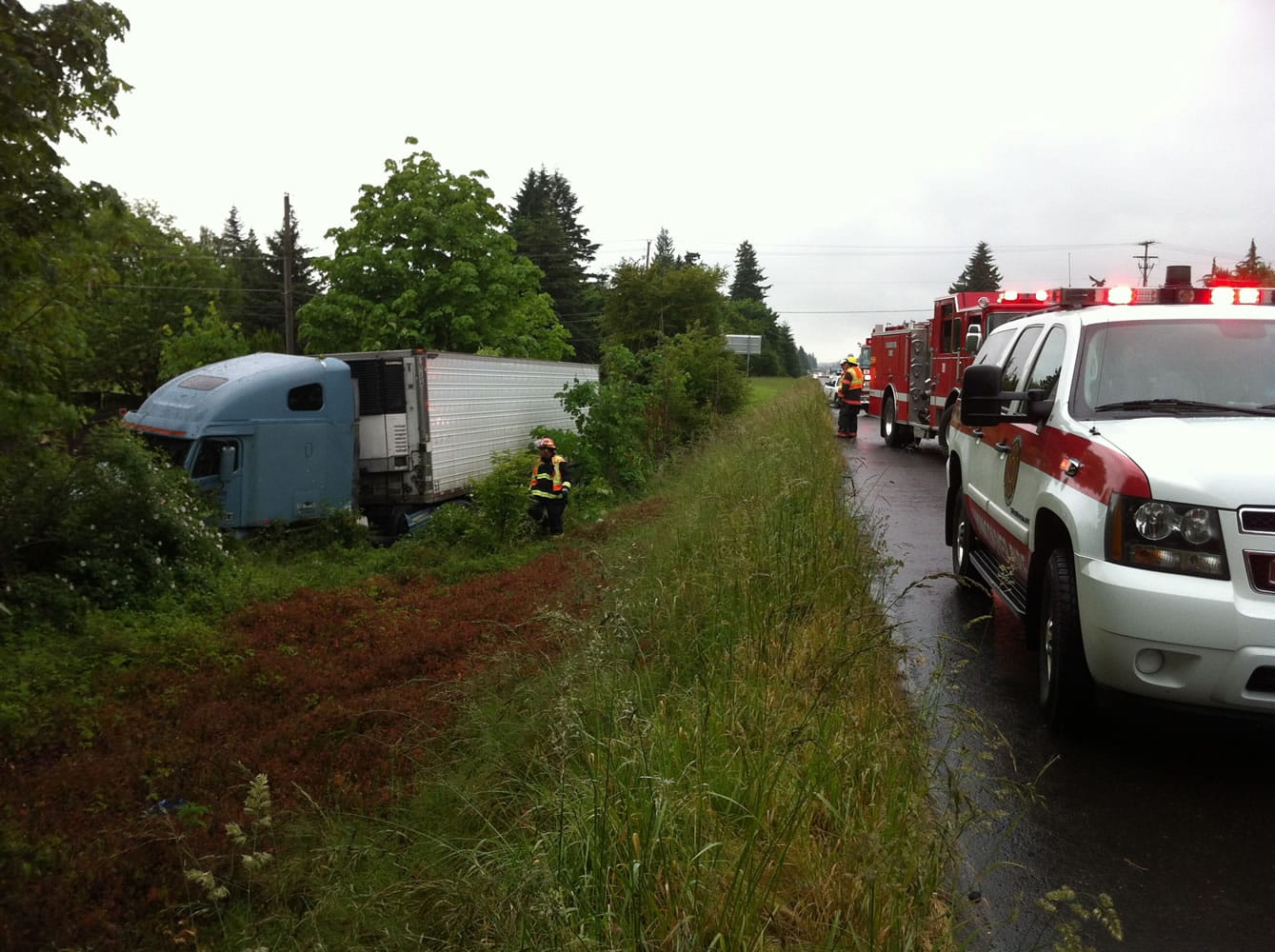 Vancouver firefighters responded Thursday morning after a tractor-trailer rig skidded off eastbound Highway 14 near the Southeast 164th Avenue exit.