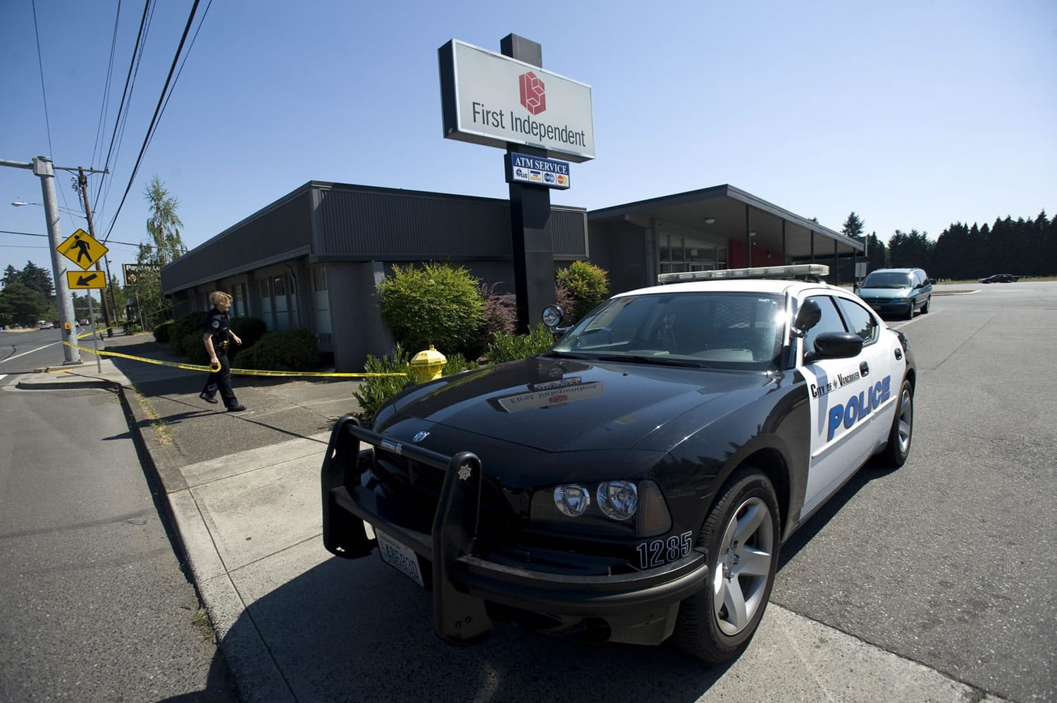 Vancouver police set up crime scene tape after a bank robbery Friday.