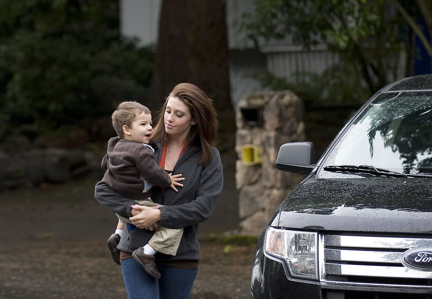 Sarah Remington drops off her son Jacob, 2, at Wendy's Teddy Bear Day Care in Vancouver in a Columbian file photo from October. Remington, a single mom, received a $3,000 bill in the mail from the state saying it paid her for child care subsidies for which she was ineligible. The state approved Remington in error, and now, she's responsible for the bill, which she can't afford.