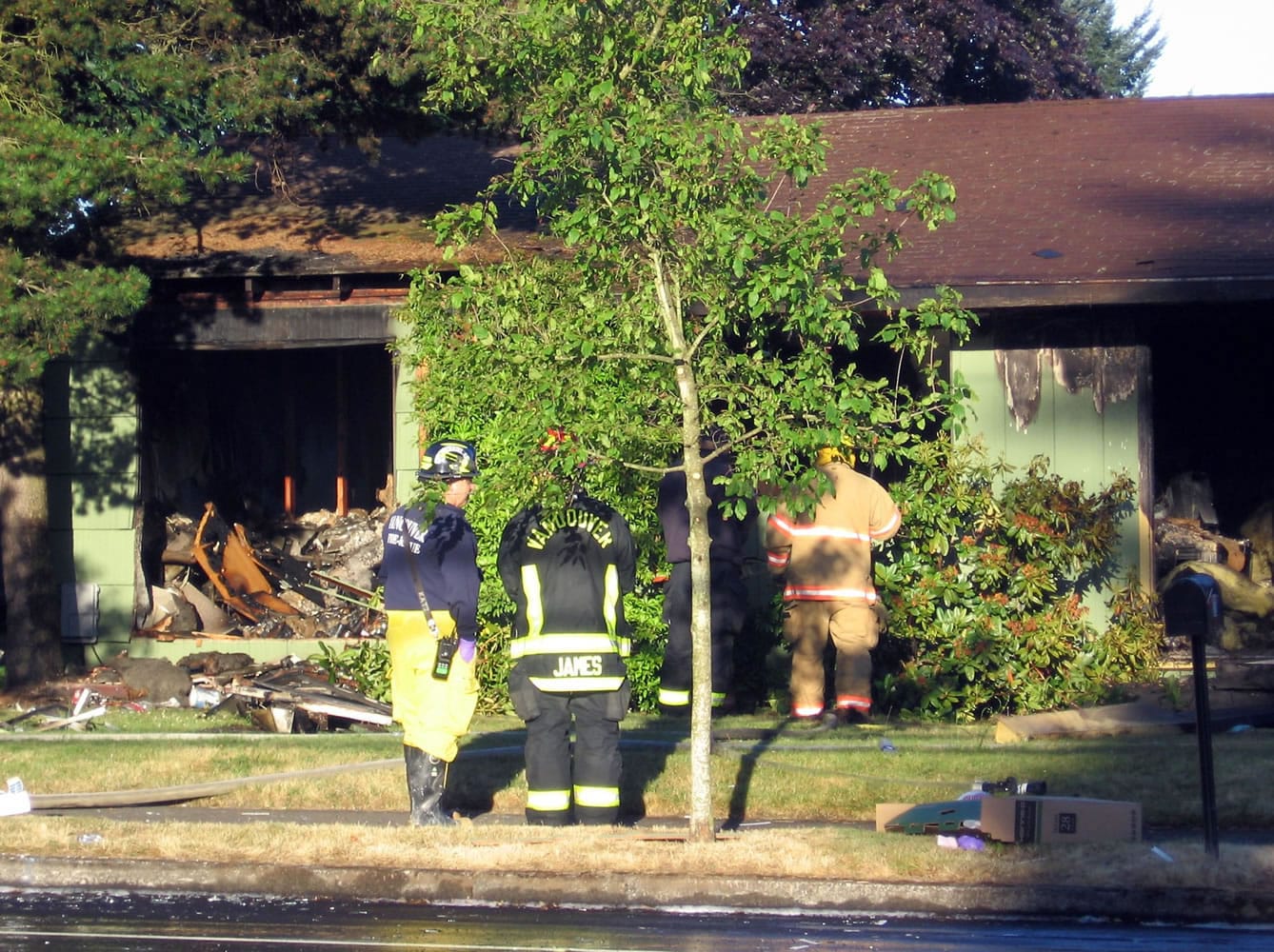 Vancouver firefighters work a house fire on Lieser Road early Monday morning.