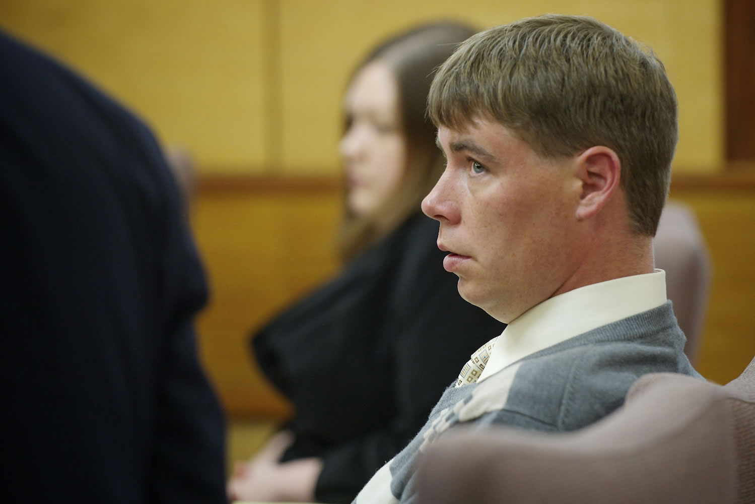 John Eckhart listens to his attorney, Jon McMullen, Monday in Clark County Superior Court.
