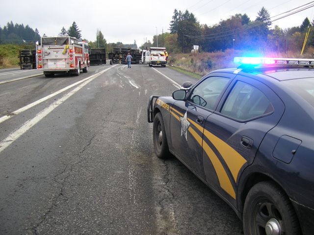 Highway 99W at Highway 18 re-opened late Thursday afternoon after an over 6 hour closure caused by an overturned commercial truck and trailer.
