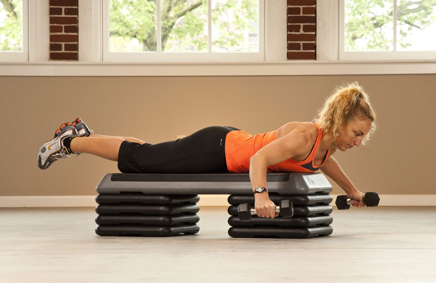 Upper Body - Reverse Flies:  Lay on your stomach over a bench, grab a light set of handweights and position both arms straight to the side beside shoulders. Use your back muscles to slightly extend your spine so you are not collapsed and flexed over the bench.