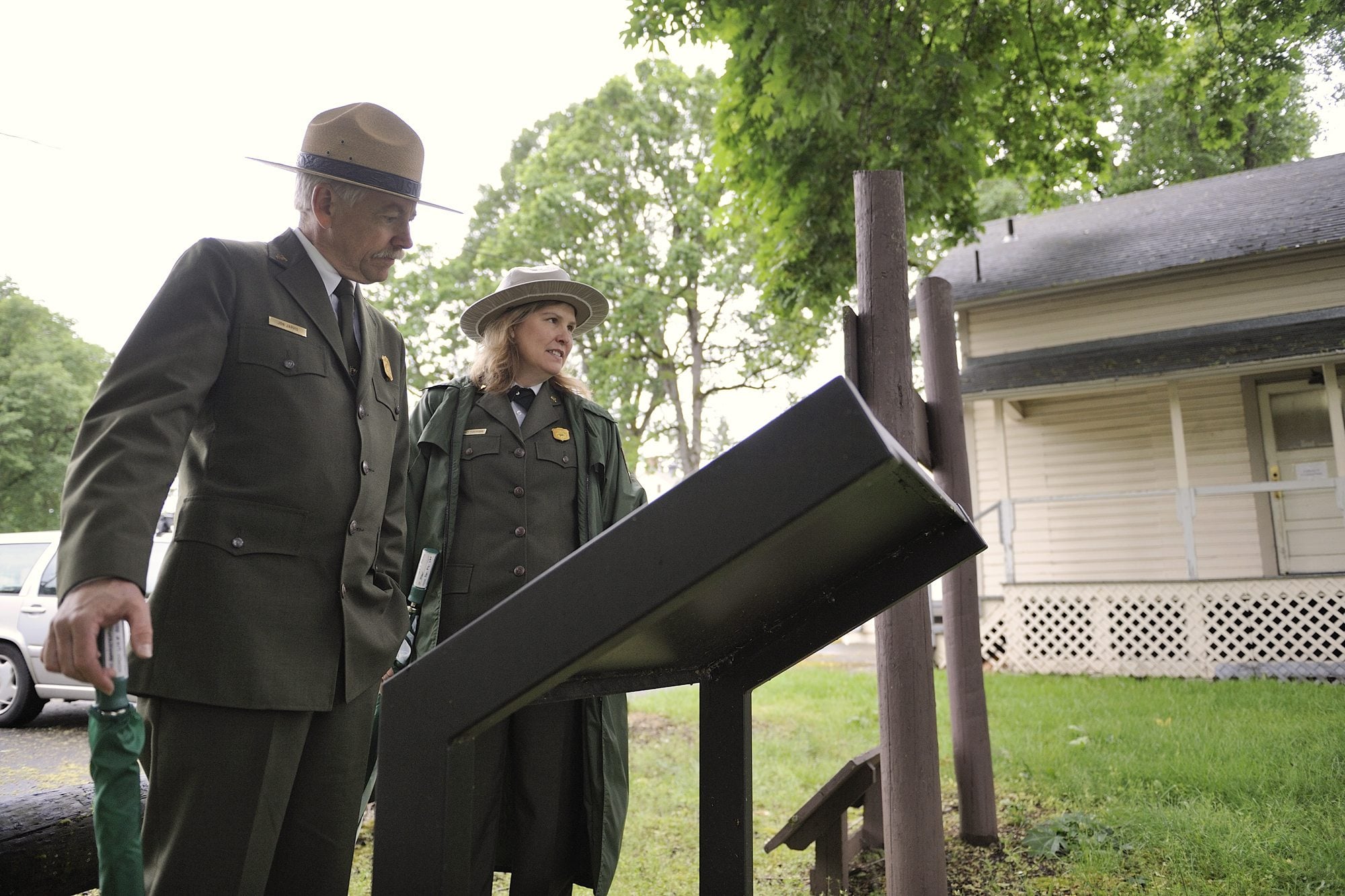 National Park Service Director Jon Jarvis, left, and Fort Vancouver Superintendent Tracy Fortmann walk through the East Vancouver Barracks during his 2010 visit to Vancouver.