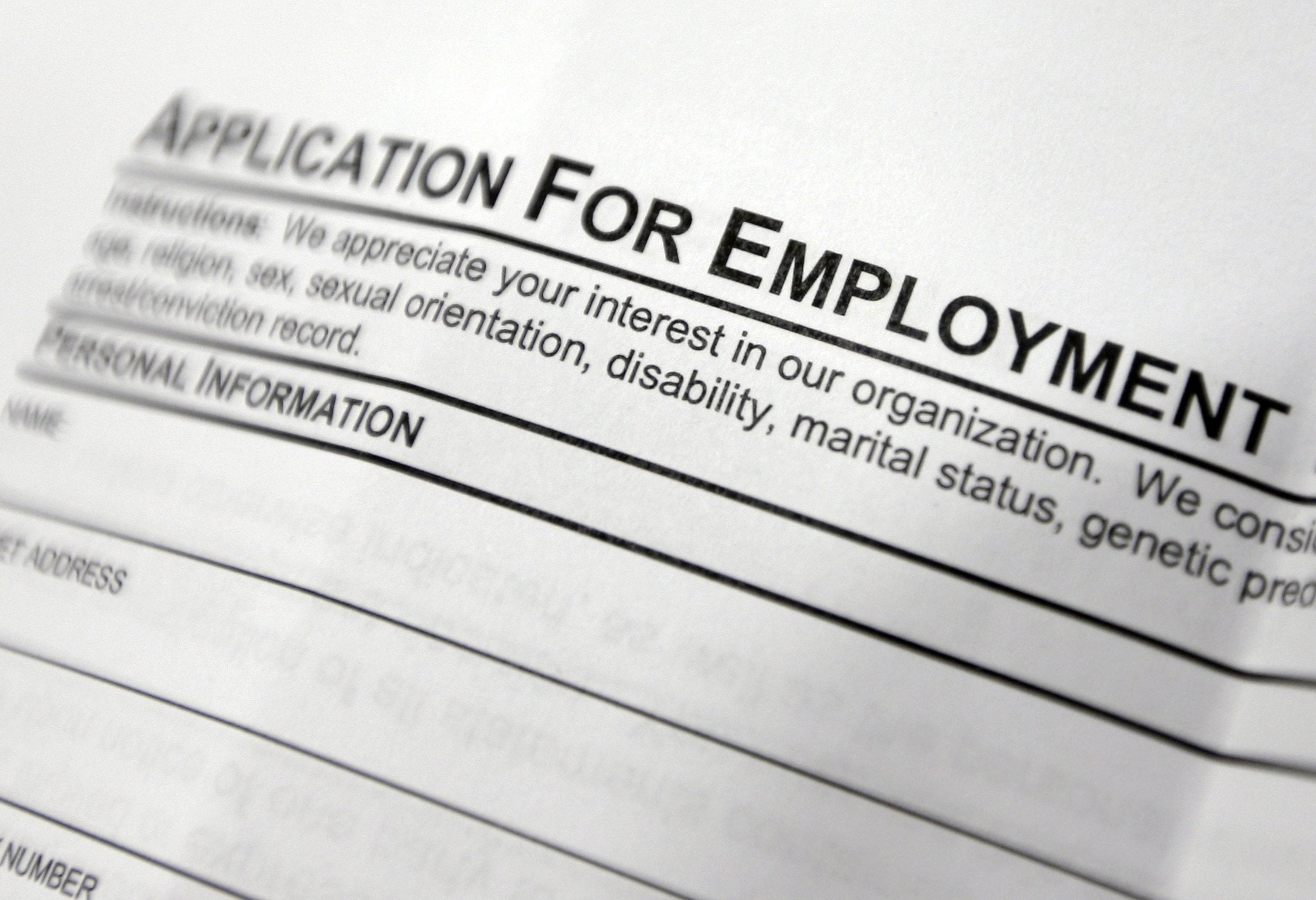 FILE - This April 22, 2014, file photo shows an employment application form on a table during a job fair at Columbia-Greene Community College in Hudson, N.Y. The Labor Department releases its weekly report on applications for unemployment benefits on Thursday, Feb. 4, 2016.
