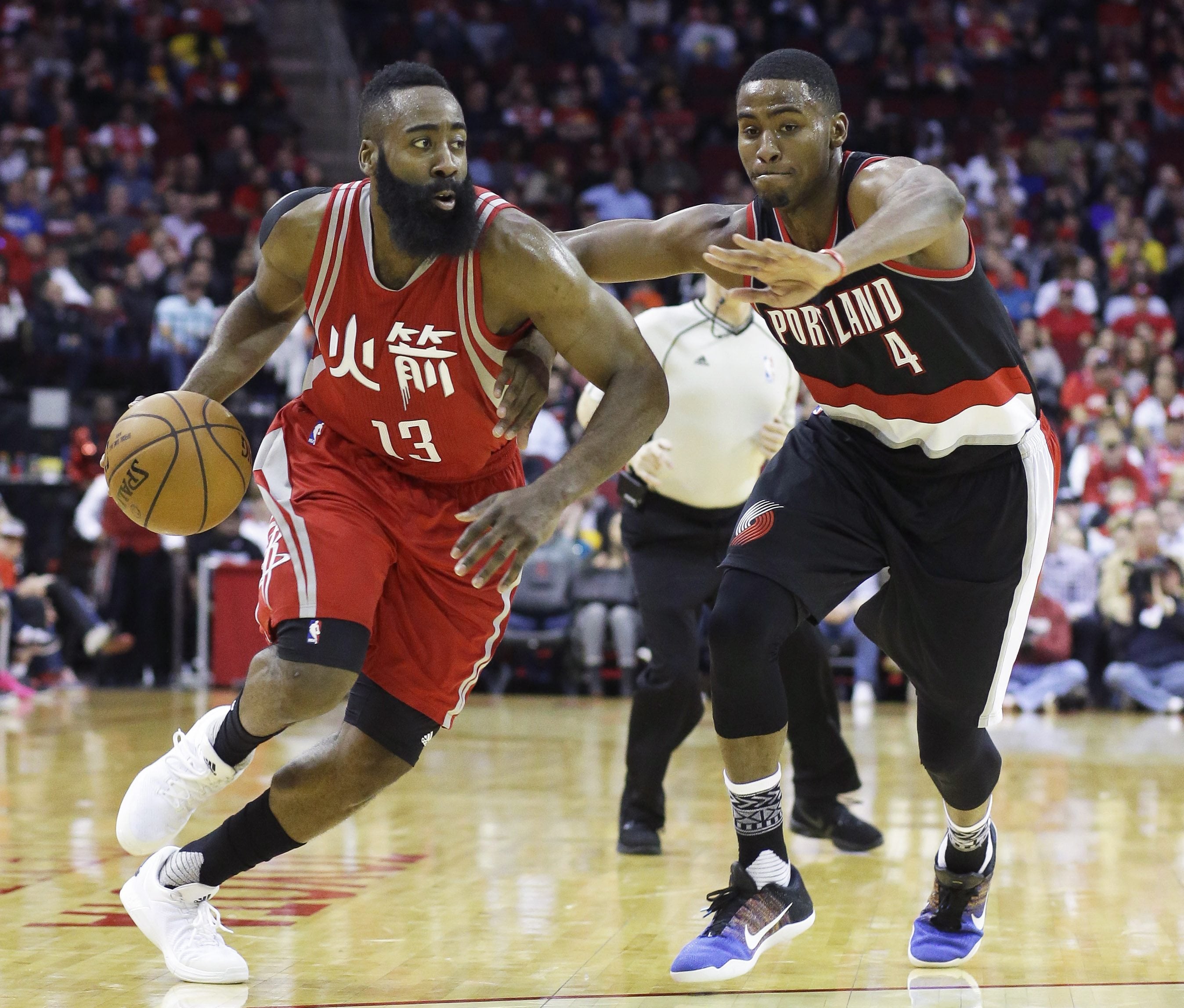 Houston Rockets&#039; James Harden (13) drives the ball past Portland Trail Blazers&#039; Maurice Harkless (4) in the second half of an NBA basketball game Saturday, Feb. 6, 2016, in Houston. Portland won 96-79.