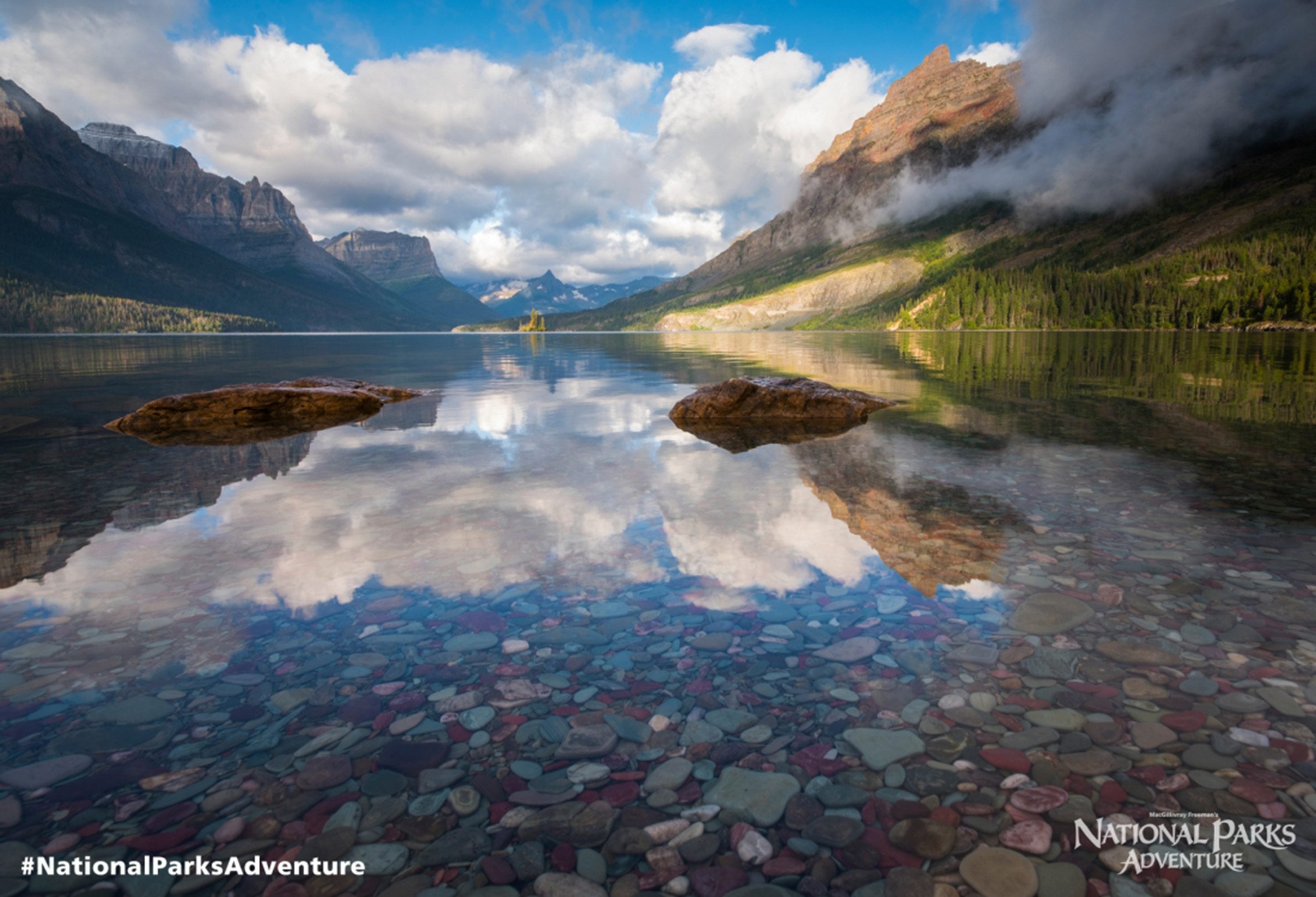 Sky and mountains reflecting on St. Mary&#039;s Lake in Glacier National Park, Montana.