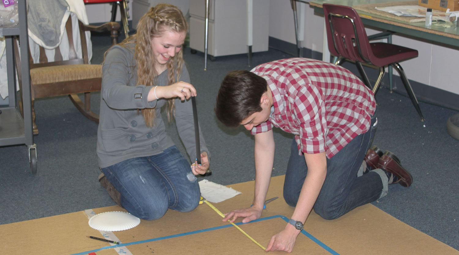CHS Science Olympiad team members, including sophomore Katelynne Jones (left) and senior Ryan Gompertz (right) gathered Monday night to practice for the upcoming national tournament on May 20 and 21 in Wisconsin. Five days a week the team works out of its &quot;clubhouse,&quot; one of the portables at Lacamas Heights Elementary School.