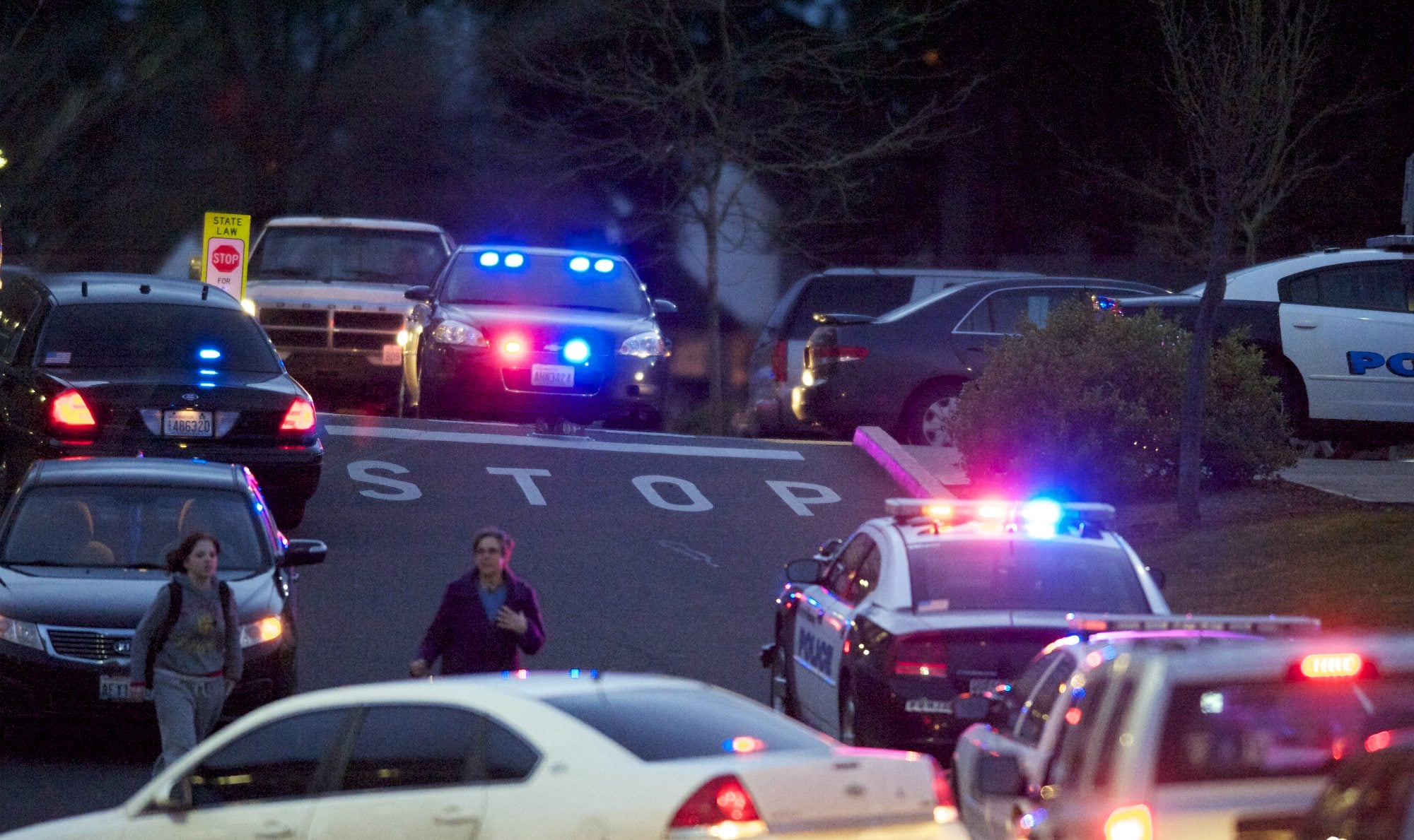 People are evacuated from the Center for Community Health after reports of shots fired on Feb. 4, 2014, at the Vancouver VA campus. A man shot in the incident is suing the county.