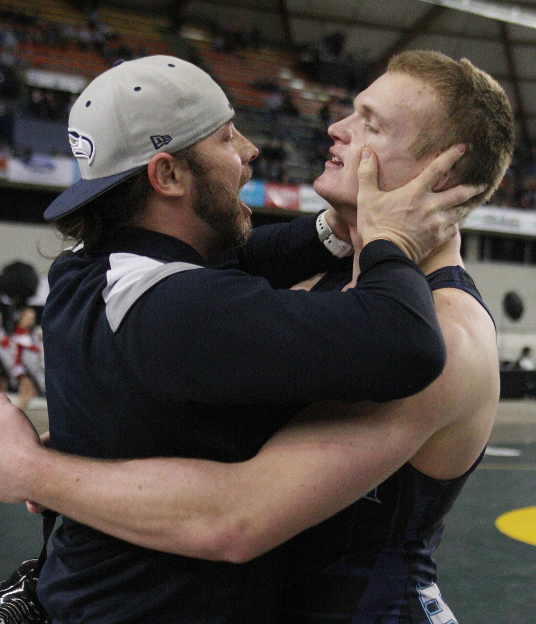 Hockinson assistant coach Rich Day celebrates with Cameron Loos after he pinned Cheney's Michael Ferguson to take the gold medal in the 220 match on Saturday, February 19, 2016 at the Mat Classic XXVIII Championship matches held in the Tacoma Dome.