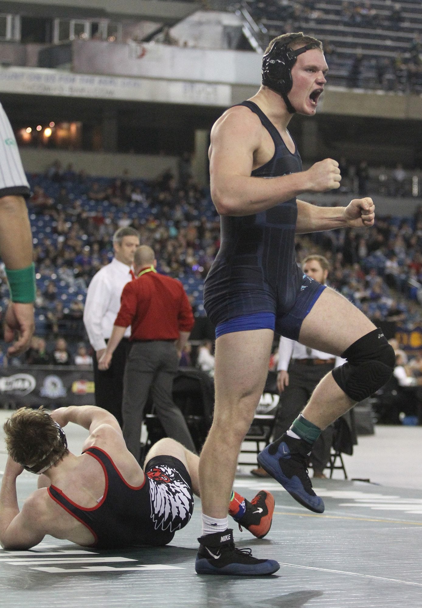 HOCKINSON's  Cameron Loos celebrates after pinning  CHENEY's Michael Ferguson to take the gold medal in the 220 match on Saturday, February 19, 2016 at the Mat Classic XXVIII Championship matches held in the Tacoma Dome.