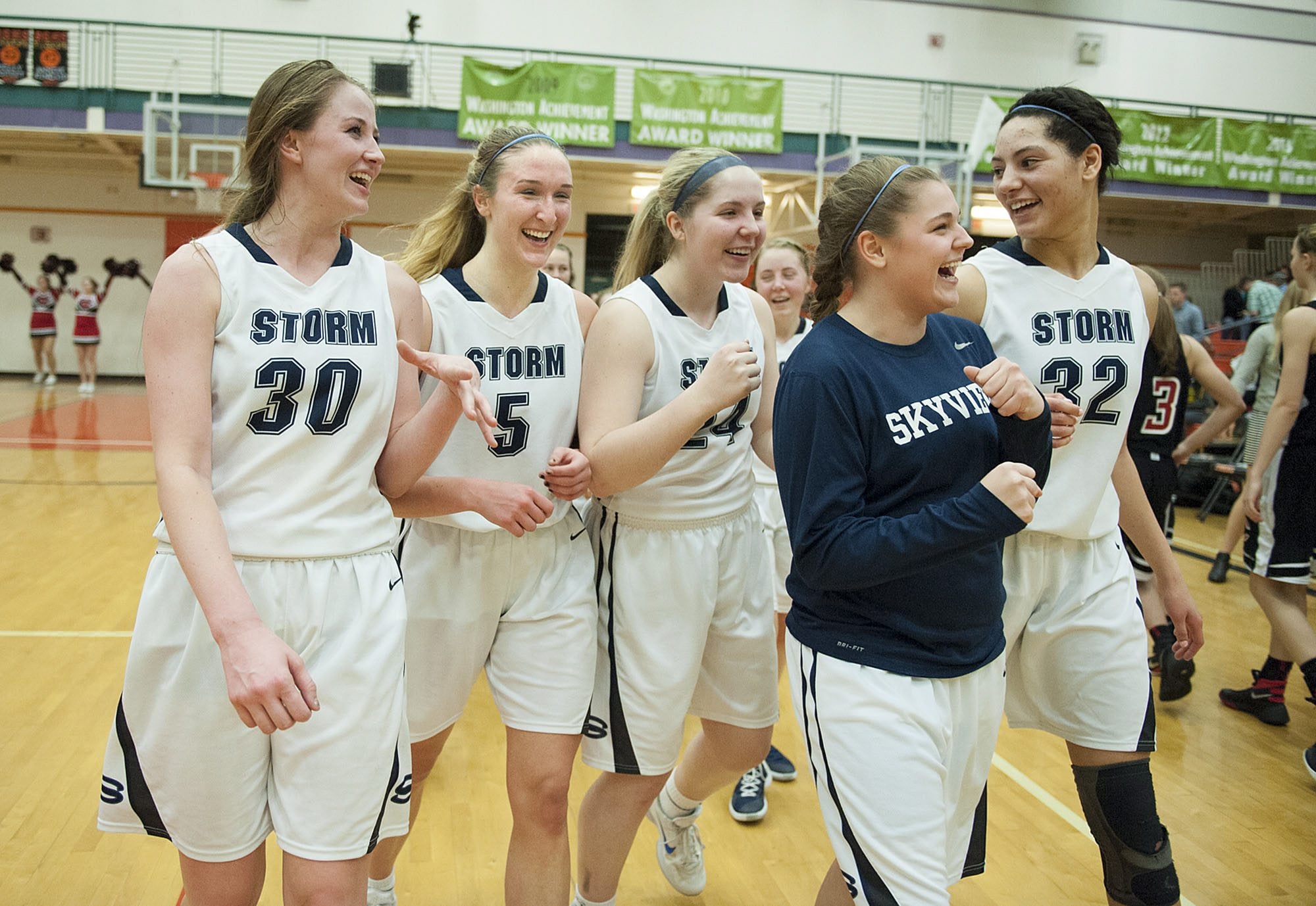 Members of the Skyview girls basketball team celebrate after their win over Camas Tuesday evening, Feb. 16, 2016 at Battle Ground High School.