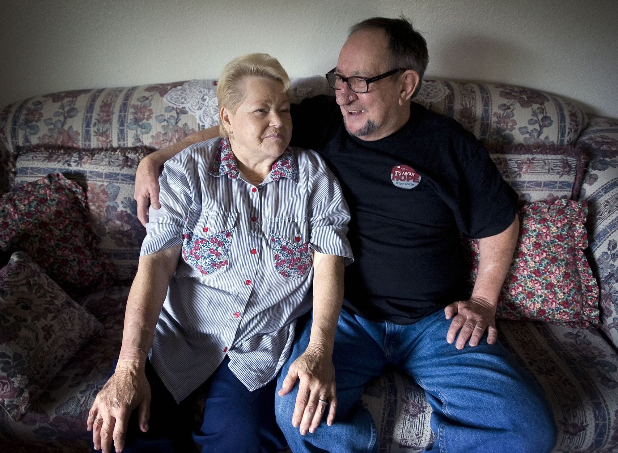 LaDonna, left, and George Lopossa chat at their Battle Ground home Friday. LaDonna Lopossa was dying from leukemia when she began using the experimental drug Gleevec.