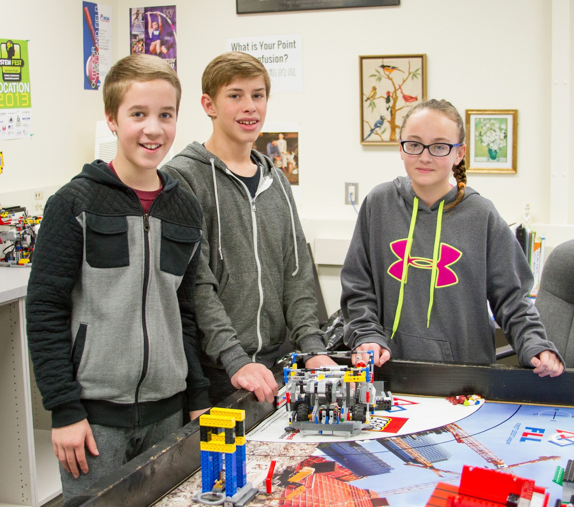 Woodland: Members of the Woodland Middle School Lego Robotics Class Ole Warndahl, from left, Aaron Shaw and Ashley Burney on a field trip to tour University of Washington&#039;s three-dimensional printer research lab.